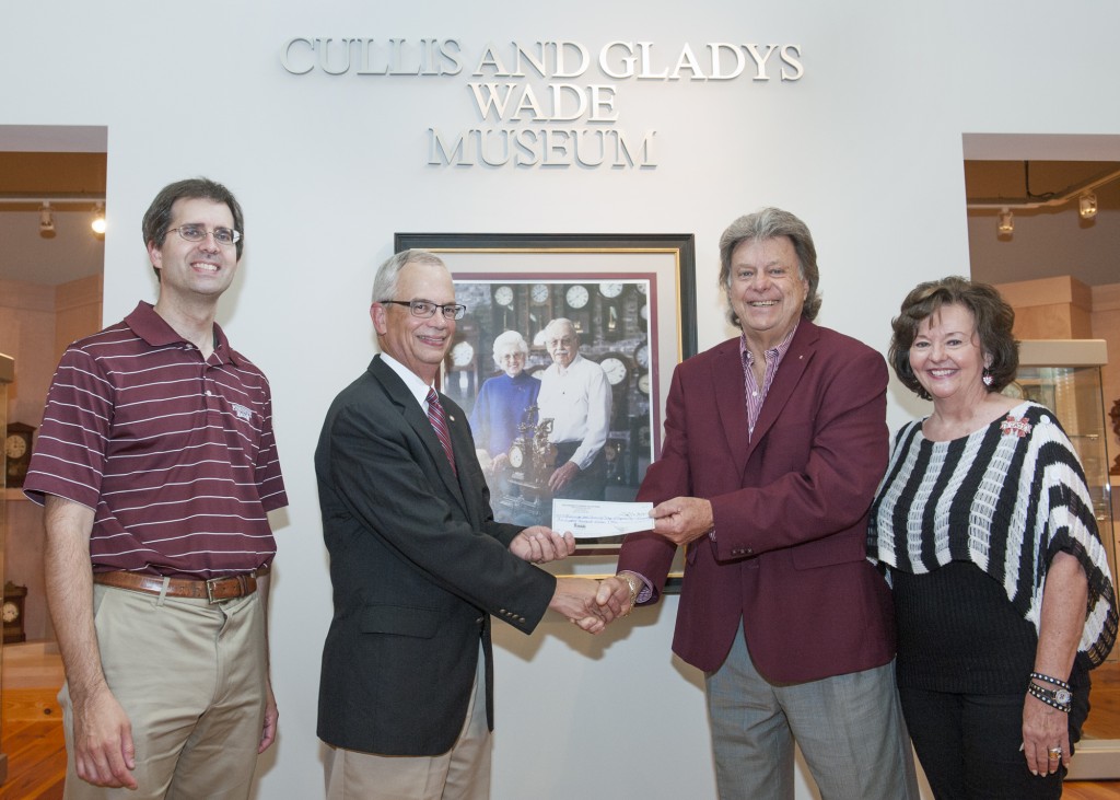 John and Mary Boulware present interim dean Jason Keith and provost Jerry Gilbert the check to establish the Cullis Wade Endowed Scholarship