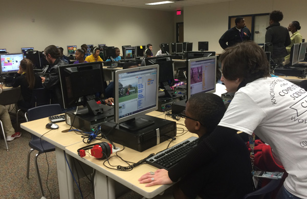 High school students participate in Hour of Code to introduce middle and elementary schoolers to computer science.