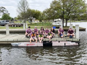 Group shot of team with concrete canoe.