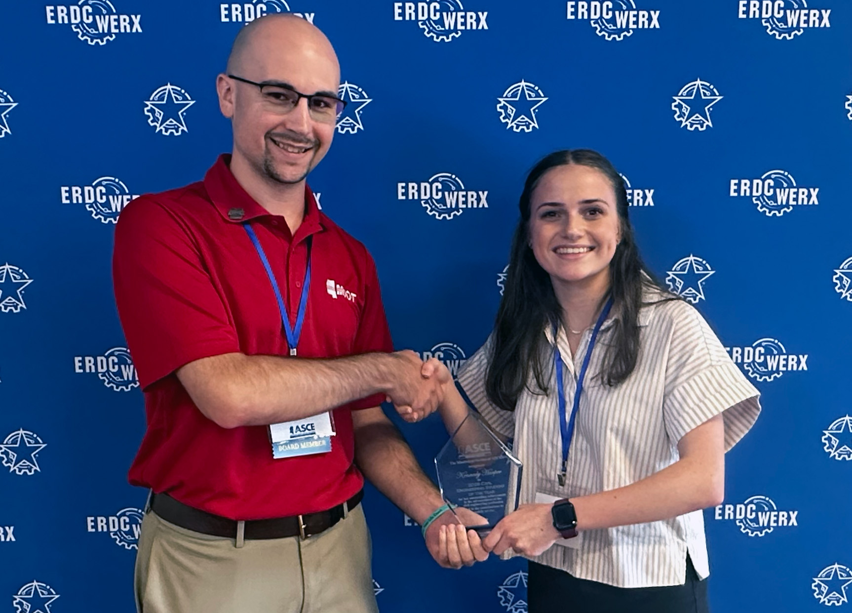 Incoming section president Jackson Dew, left, presents junior Kennedy Harper with the Civil Engineering Student of the Year award.