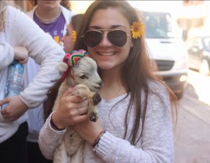 Biological engineering major Karlee Mott with a baby goat