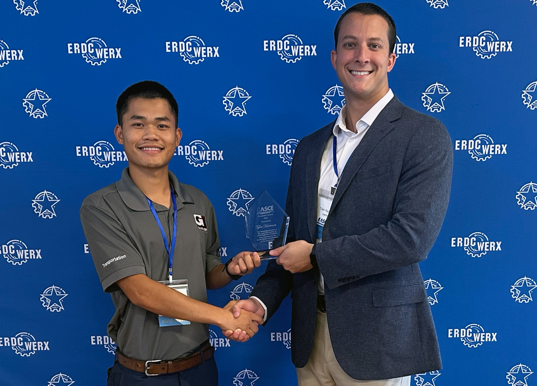 Ziai Li, left, presents the President’s Award to Tyler Hartman.