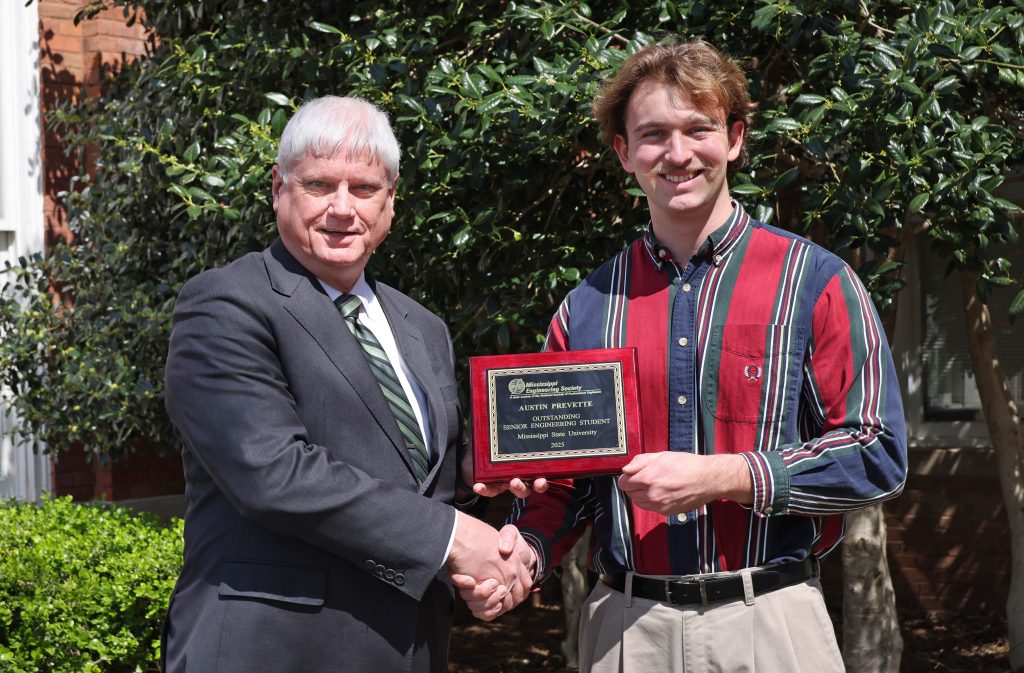 MES award winner Austin Prevette (right) with Associate Dean of Academics Robert Green.