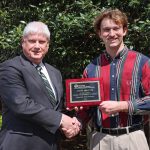 MES award winner Austin Prevette (right) with Associate Dean of Academics Robert Green.