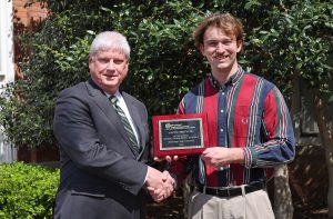 MES award winner Austin Prevette (right) with Associate Dean of Academics Robert Green.